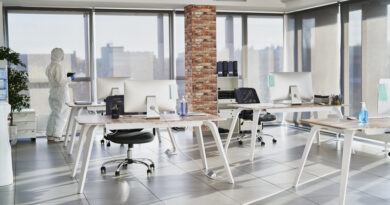 Person in protective workwear alone in an empty office